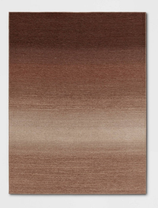 5'3 x 7 Rectangular woven outdoor/indoor rug. UV resistant  and pet friendly.